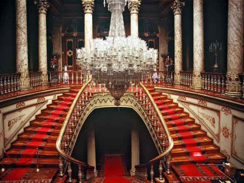 Large chandelier and imperial red staircase in Dolmabahce Palace