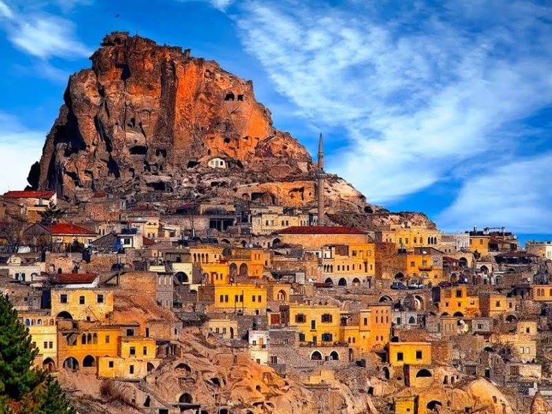 Image of fairy chimneys and houses in Cappadocia on sunny day