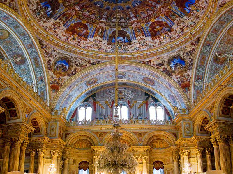 Grand chandelier and decorative painted palace ceiling in Dolmabahce Palace