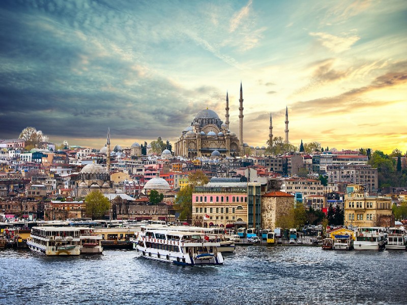 Boats, city landscape and Blue Mosque or Hagia Sophia from Bosporus