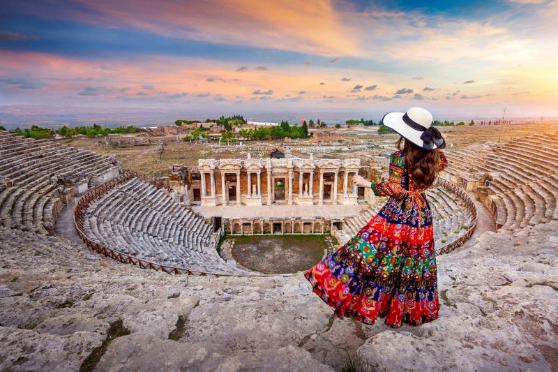 Woman in a dress overlooking the Amphitheatre at Hierapolis