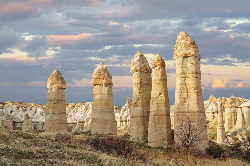 Image of fairy chimneys and houses in Cappadocia on sunny day