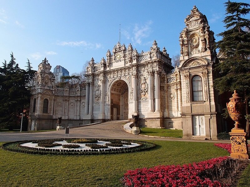 Garden, sunny day with main entrance to Dolmabahce Palace in background