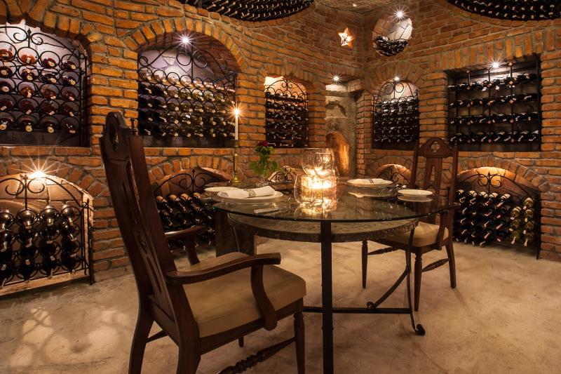 Candlelit table in wine cellar